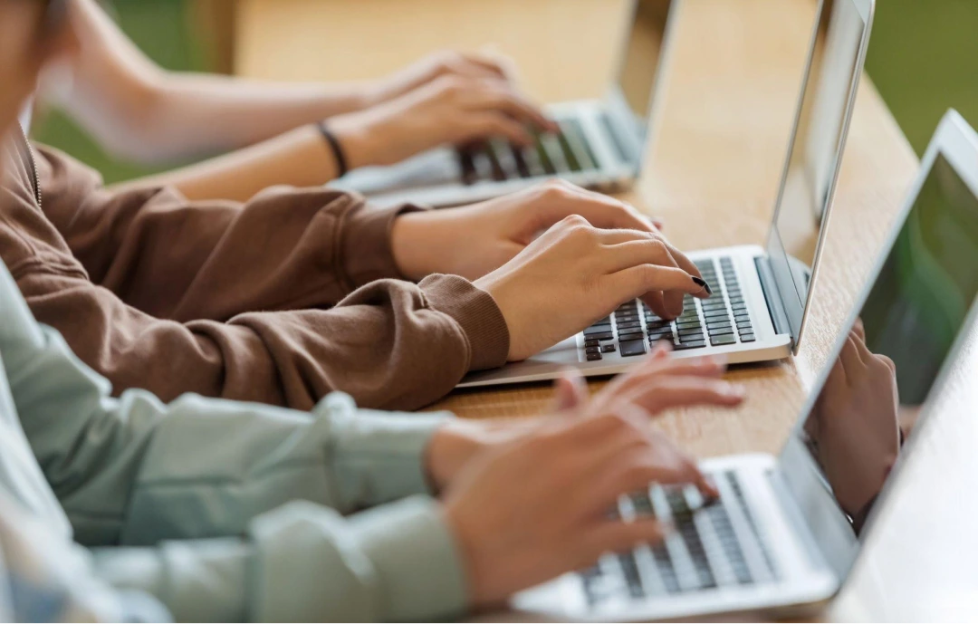 people typing on computers